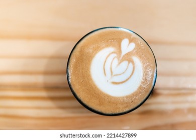 Espresso Coffee Cup Top Down Picture In Brown Wood Background With Heart Art Mixed With Milk. Barista Coffee Art With Latte Milk On Top. Delicious Espresso Latte Coffee Wallpaper.