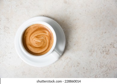 Espresso Coffee Drink in Simple White Mug on Stone Counter top