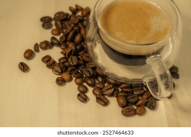 Espresso coffee glass cup. Coffee cup and roasted coffee beans close up. Macro photo. - Powered by Shutterstock