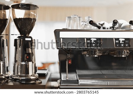 Espresso machine and coffee grinder on café counter