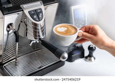 Espresso machine with coffee grinder in white interior latte art in white cup barista working making latte art cafe. Clean look and modern white background Cappuccino  - Powered by Shutterstock