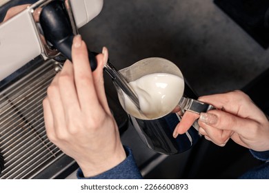 Espresso machine pours fresh black coffee closeup. Coffee machine preparing fresh coffee and pouring into yellow cups at restaurant, bar or pub. - Powered by Shutterstock