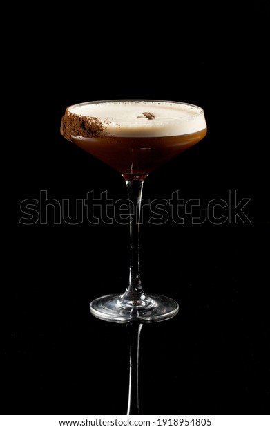 Espresso\
Martini cocktail isolated on a black\
background