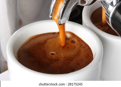 Espresso Pouring Into A Cup