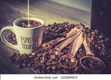 Espresso Shot With Coffee Beans And Creamer Mixing With Coffee