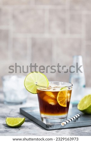 Espresso tonic - refreshment summer drink with tonic water, lime and coffee