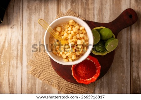 Esquites. Corn kernels cooked and served with mayo, sour cream, lemon and chili powder, very popular street food in Mexico, also known as Elote en Vaso. The recipe varies depending on the region.