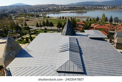 Esrefoglu Mosque and Complex, located in Beysehir, Konya, Turkey, was built in 1299. It consists of a mosque, covered bazaar, tomb, bath and madrasah.