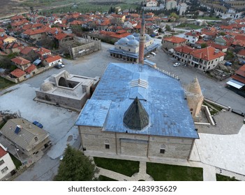 Esrefoglu Mosque and Complex, located in Beysehir, Konya, Turkey, was built in 1299. It consists of a mosque, covered bazaar, tomb, bath and madrasah.