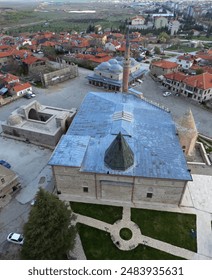 Esrefoglu Mosque and Complex, located in Beysehir, Konya, Turkey, was built in 1299. It consists of a mosque, covered bazaar, tomb, bath and madrasah.