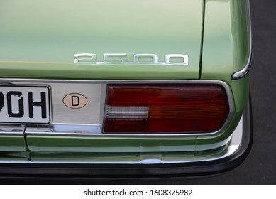 ESSEN, GERMANY - APRIL 10, 2019: BMW 2500 E3 Classic German Old Retro Vintage Luxury Executive 1970s Car In Light Green Color Tail Light Detail