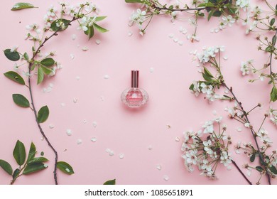 Essence of flowers on a table in a beautiful glass jar