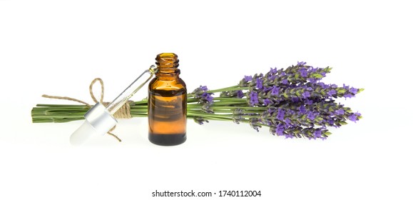 Essential Lavender Oil In The Bottle With Dropper Isolated On White Background. Horizontal Close-up.