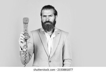 Essential To Life. Man Speak On Phone. Serious Man With Retro Phone. Brutal Bearded Man Hold Vintage Telephone. Concept Of Technology In Modern Life. Communication. Idea Of Conversation