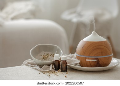 Essential oil aroma diffuser humidifier diffusing water articles in the air. - Shutterstock ID 2022200507