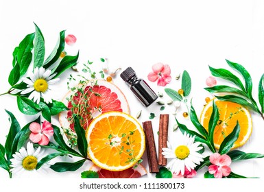 Essential Oil For Beauty Skin. Flat Lay Beauty Ingredients On A Light Background, Top View. Beauty Healthy Lifestyle Concept. Copy Space 