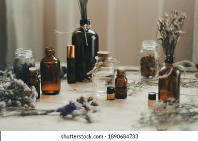 Essential oil and dried flowers - Shutterstock ID 1890684733