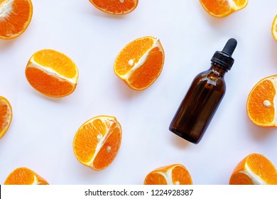 Essential Oil With Orange On White