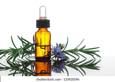 Essential oil with rosemary flowers