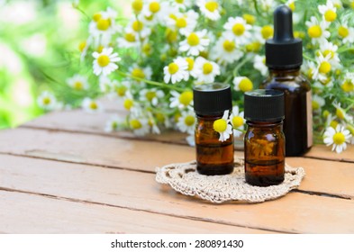 essential oils for aromatherapy treatment with flowers