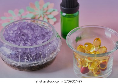 Essential Oils With Bath Salts,shot On A Pastel Gradient Surface,the Image Was Shot Close Up And From Slightly Above.