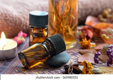 Essential Oils With Herbs And Candle