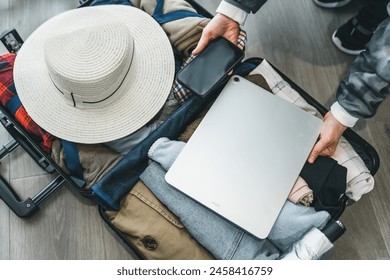 Essential Packing for Modern Travel: Tech and Clothing - Powered by Shutterstock