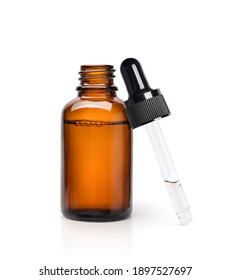 Essential Serum Oil In Amber Dropper Bottle Isolate On White Background.