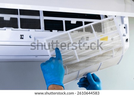 Essential Steps for Maintaining Air Conditioning: Cleaning a Filter for Optimal Cooling Performance and Energy Efficiency at Home or Office Environments