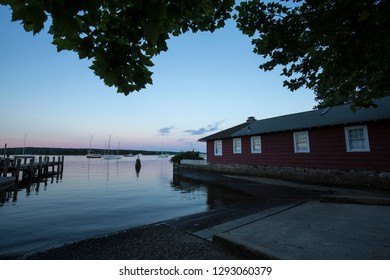 ESSEX, CONNECTICUT, USA - June 19, 2018: Boat launch at Essex Harbor on the Connecticut River with afterglow of the recent sunset.