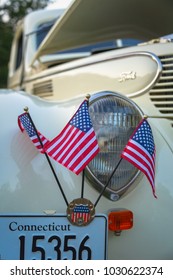 Essex, CT / USA - September 13, 2011: American Flags And Vintage White Ford