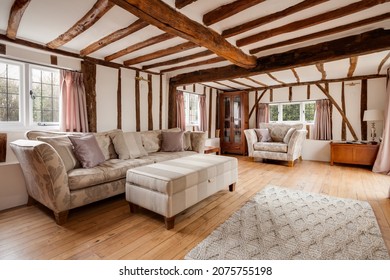 Essex, England - January 18 2019: Traditional Heavily Beamed Living Room Lounge With Exposed Timber Floorboards