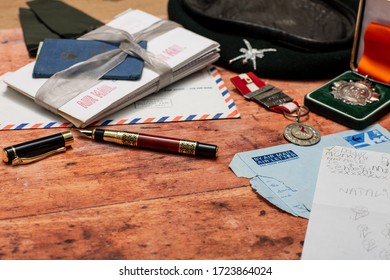 Essex, UK - 06 May 2020 Army Memorabilia Flay Lay On An Old Wooden Table