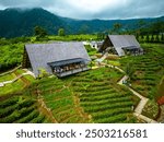 Established Aerial View of Unique Restaurant With Triangular Roof In The Middle Of Ciater Tea Plantation. West Java, Indonesia