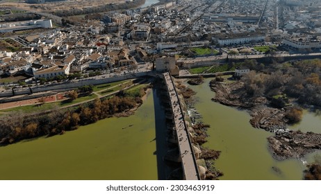 Establishing Aerial View Shot of The Roman bridge of Cordoba, a bridge in the Historic centre of Cordoba, Andalusia, southern Spain - Shutterstock ID 2303463919