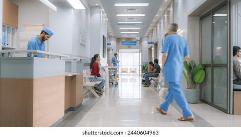 Establishing Shot of Active Local Indian Health Clinic Lobby, Representing Modern and Advanced Healthcare Services with Nurses and Doctors. Diverse Patients Waiting in Reception Hall in a Hospital - Powered by Shutterstock