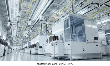 Establishing Shot Dolly Shot Inside Bright Advanced Semiconductor Production Fab Cleanroom with Working Overhead Wafer Transfer System  - Shutterstock ID 2145346979