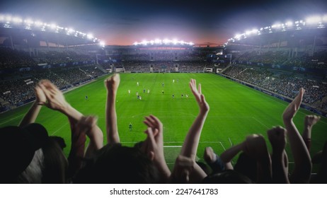 Establishing Shot of Fans Cheer for Their Favorite Team on a Stadium During Soccer Championship Final Match. Teams Play, Crowd of Fans Celebrate Victory and Goal. Football Cup Tournament. - Shutterstock ID 2247641783