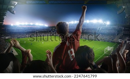 Establishing Shot of Fans Cheer for Their Team on a Stadium During Soccer Championship Match. Teams Play, Crowds of Fans Scream, Celebrate Victory, Goal. Football Cup Tournament Concept. Wide Shot