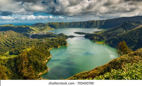 Establishing shot of the Lagoa das Sete Cidades lake taken from Vista do Rei in the island of Sao Miguel, The Azores, Portugal. The Azores are a hidden gem holiday destination in Europe.

