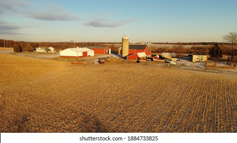 Establishing Shot Of Midwestern Farm In Winter. Aerial View Of American Countryside Landscape