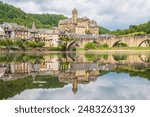 Estaing village, castle and medieval bridge over Lot river photographed in Aveyron, one of the most beautiful villages of France