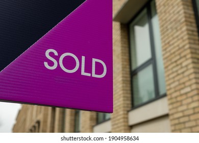 Estate Agent  'Sold' Sign On Urban UK Street