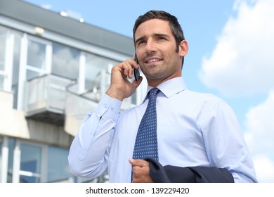 Estate Agent Stood Outside Property