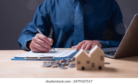 The estate agent's signature on the contract finalized the mortgage agreement, marking a significant investment in the housing property for business purposes. Homework - Powered by Shutterstock