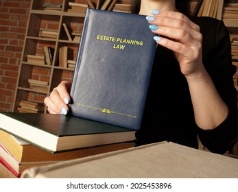  ESTATE PLANNING LAW Book In The Hands Of A Attorney. Estate Planning is The Process Of Anticipating And Arranging, During A Person's Life
