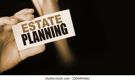 Estate Planning words on card a businessman shows. Real estate business concept. - Shutterstock ID 2204494661