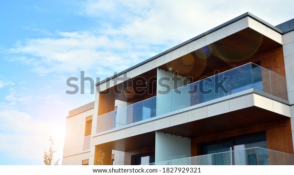 Estate property and condo architecture.\
Fragment of modern residential flat with apartment building\
exterior. Detail of new luxury home complex.\
