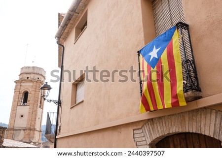 Estelada Vermella, Catalan nationalist flag, placed on balconies of a town in the interior of Tarragona.