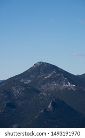 Estes Cone In Rocky Mountian National Park Mountain With Snowy Peak And Green Forest With Blue Sky